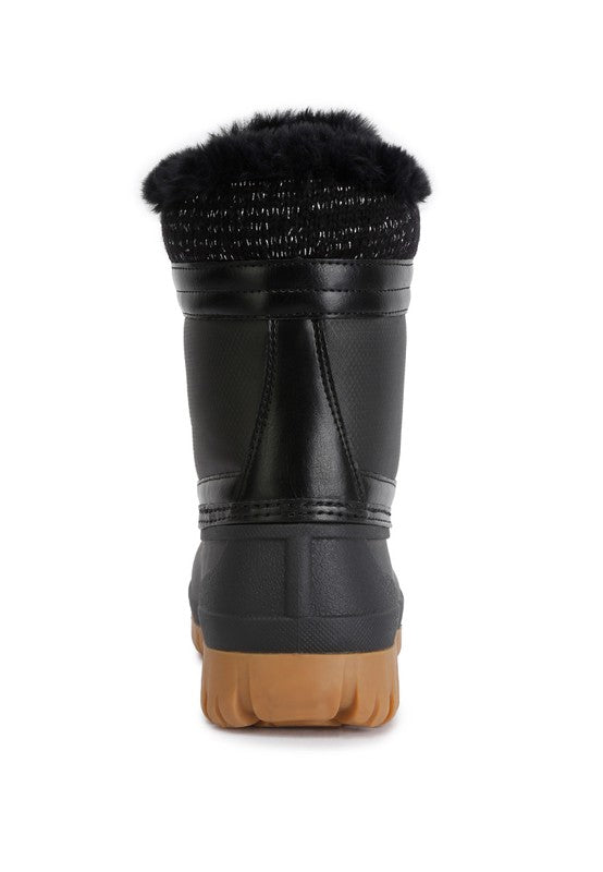 Botas con suela dentada en contraste y cuello de piel de Capucine