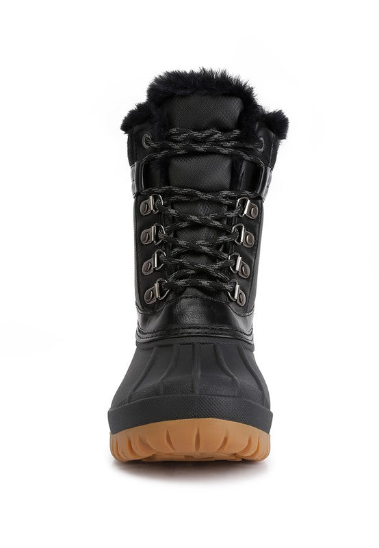 Botas con suela dentada en contraste y cuello de piel de Capucine