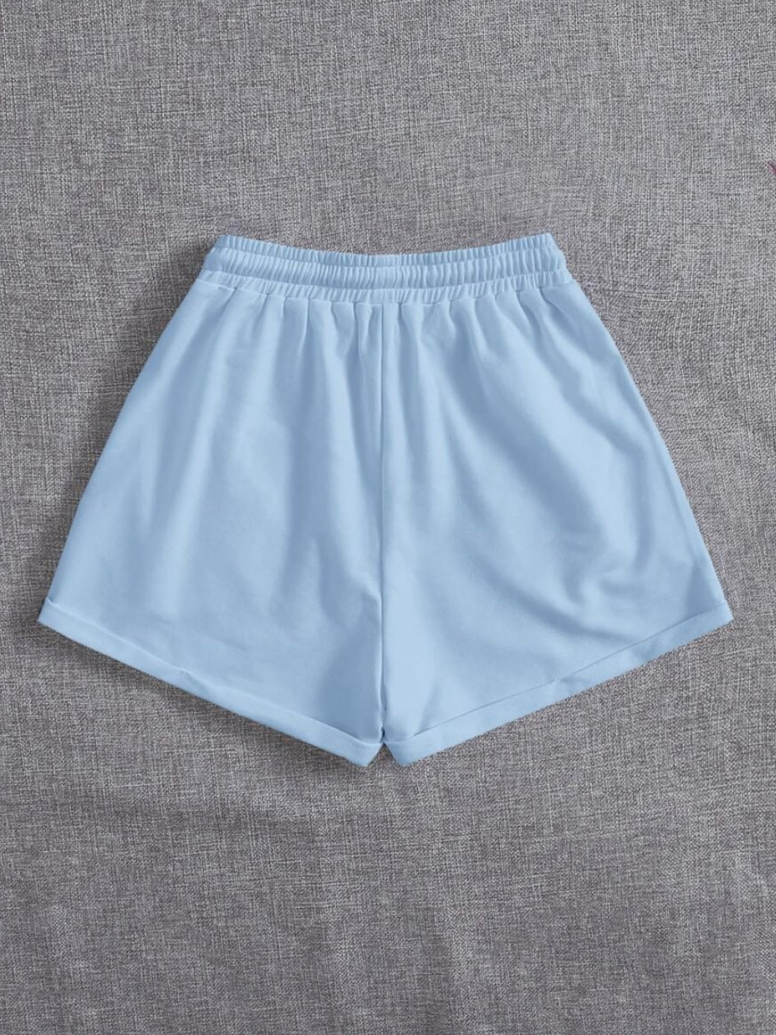 Pantalones cortos con cintura elástica y bolsillos con cordón