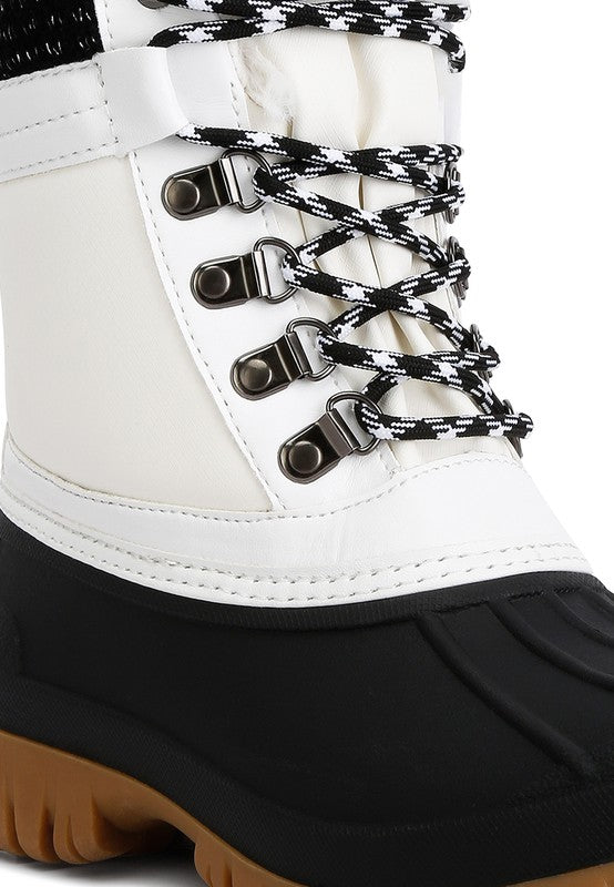 Botas con suela dentada en contraste y cuello de piel de Capucine