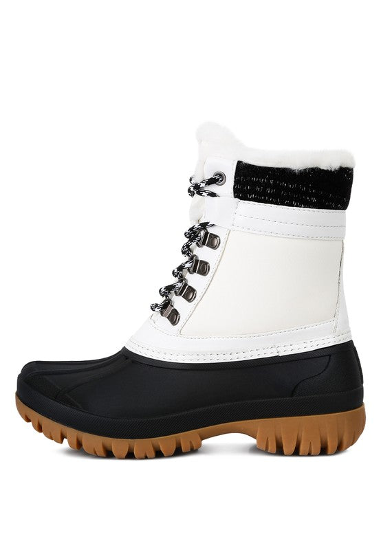 Botas con suela dentada en contraste y cuello de piel de Capucine