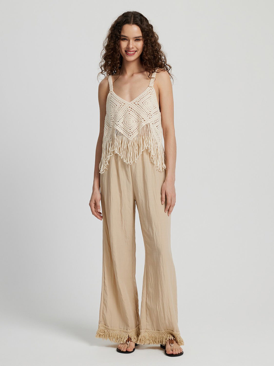 Pantalones largos de pierna ancha con dobladillo con flecos