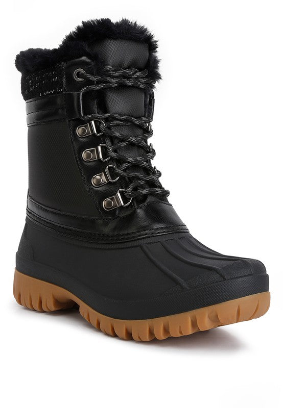 Botas con suela dentada en contraste y cuello de piel de Capucine