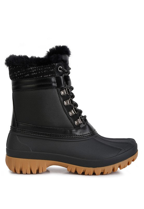 Botas con suela dentada en contraste y cuello de piel de Capucine