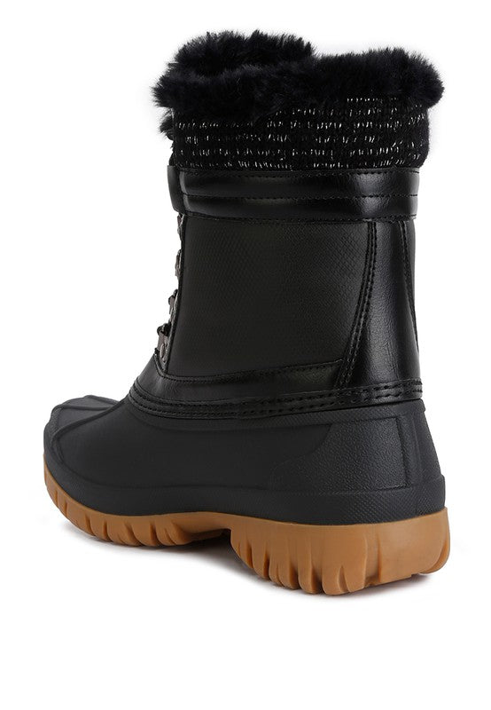Botas con suela dentada en contraste y cuello de piel de Capucine