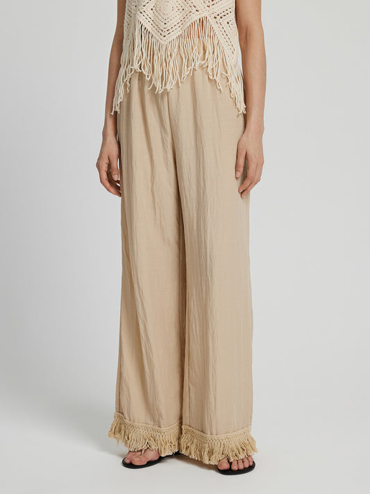 Pantalones largos de pierna ancha con dobladillo con flecos