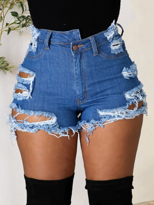 Shorts de mezclilla desgastados con dobladillo sin rematar y bolsillos