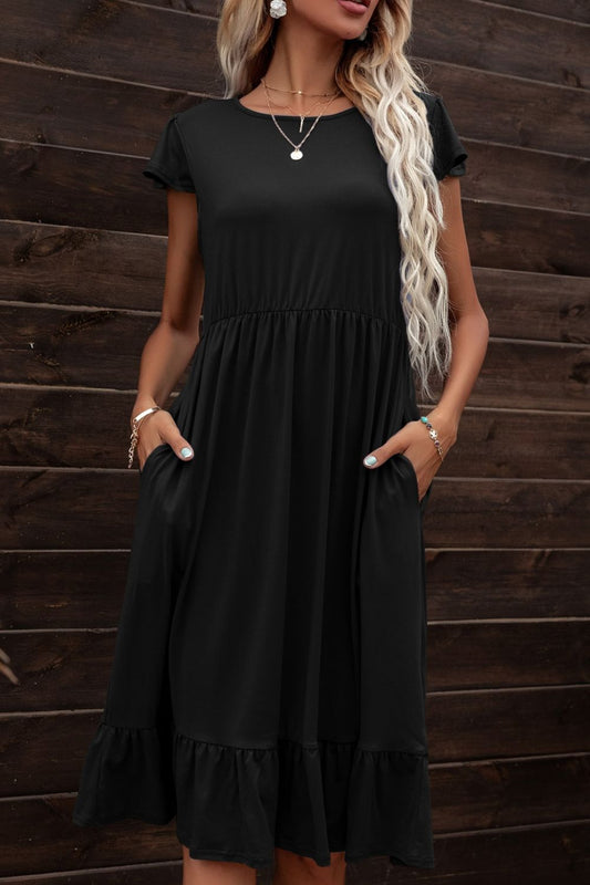 Vestido con cuello redondo y volantes en el bajo