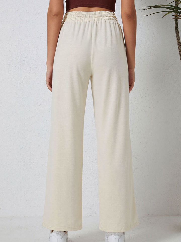 Pantalones con bolsillos y cordón ajustable en la cintura