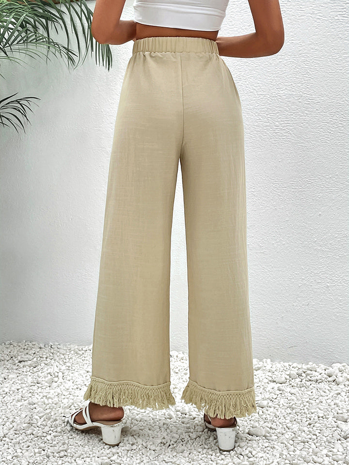 Pantalones anchos con detalle de flecos